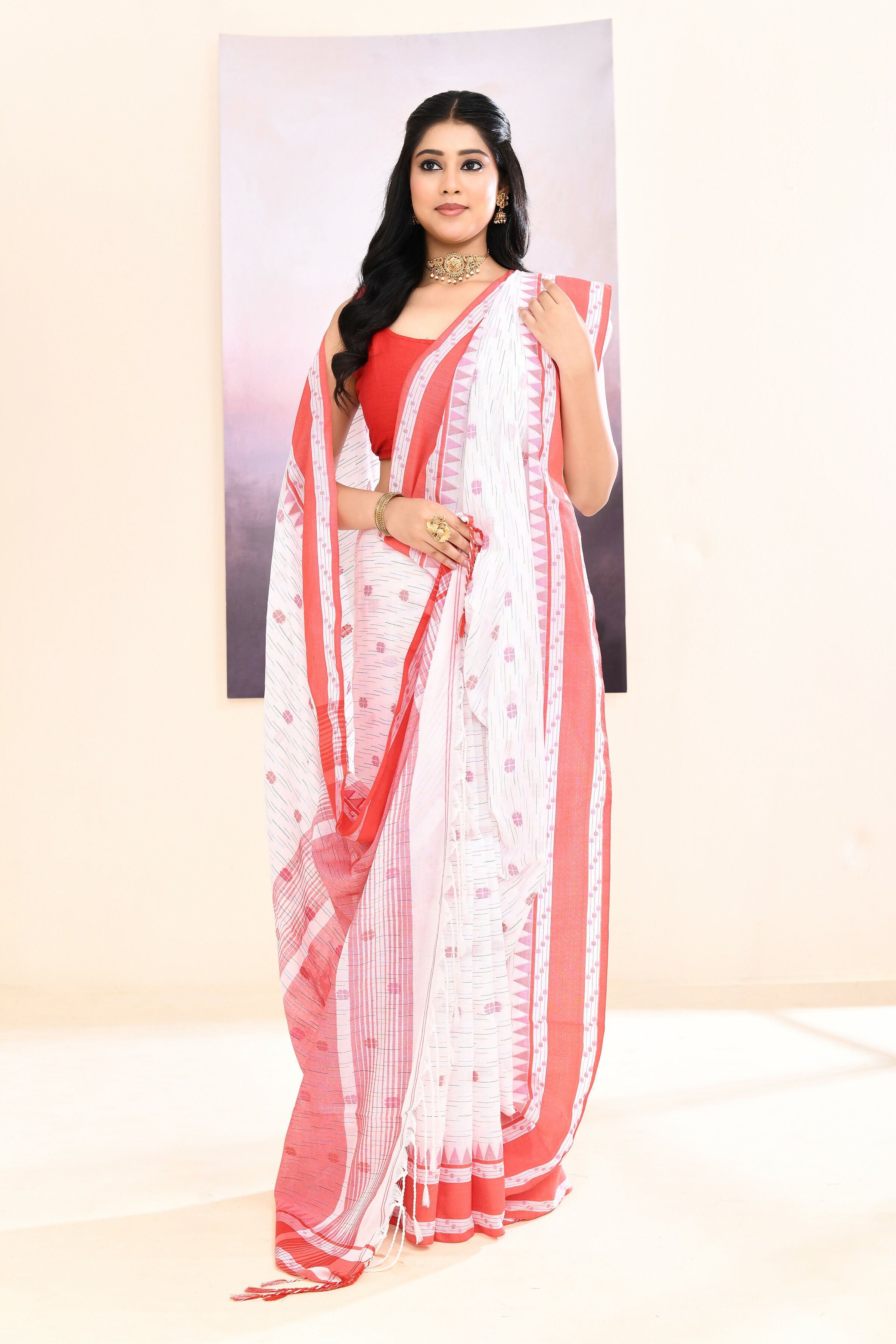 White pure cotton saree with elegant embellishments for a classic ethnic look