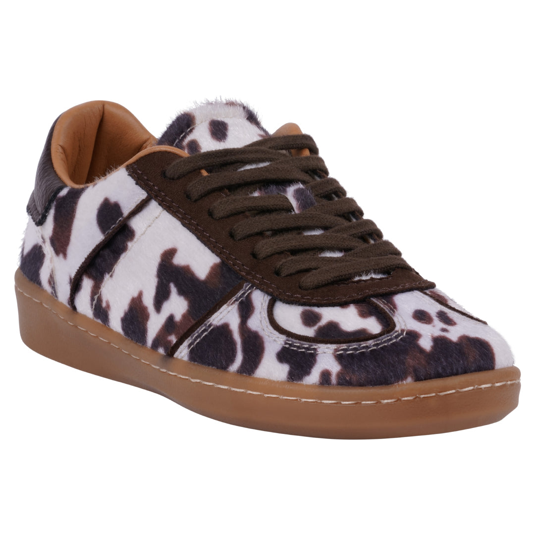 Women's Milan lace-up sneakers featuring white and brown cow print pattern