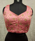 Pink readymade saree blouse with intricate golden all-over embroidery and sweetheart neckline