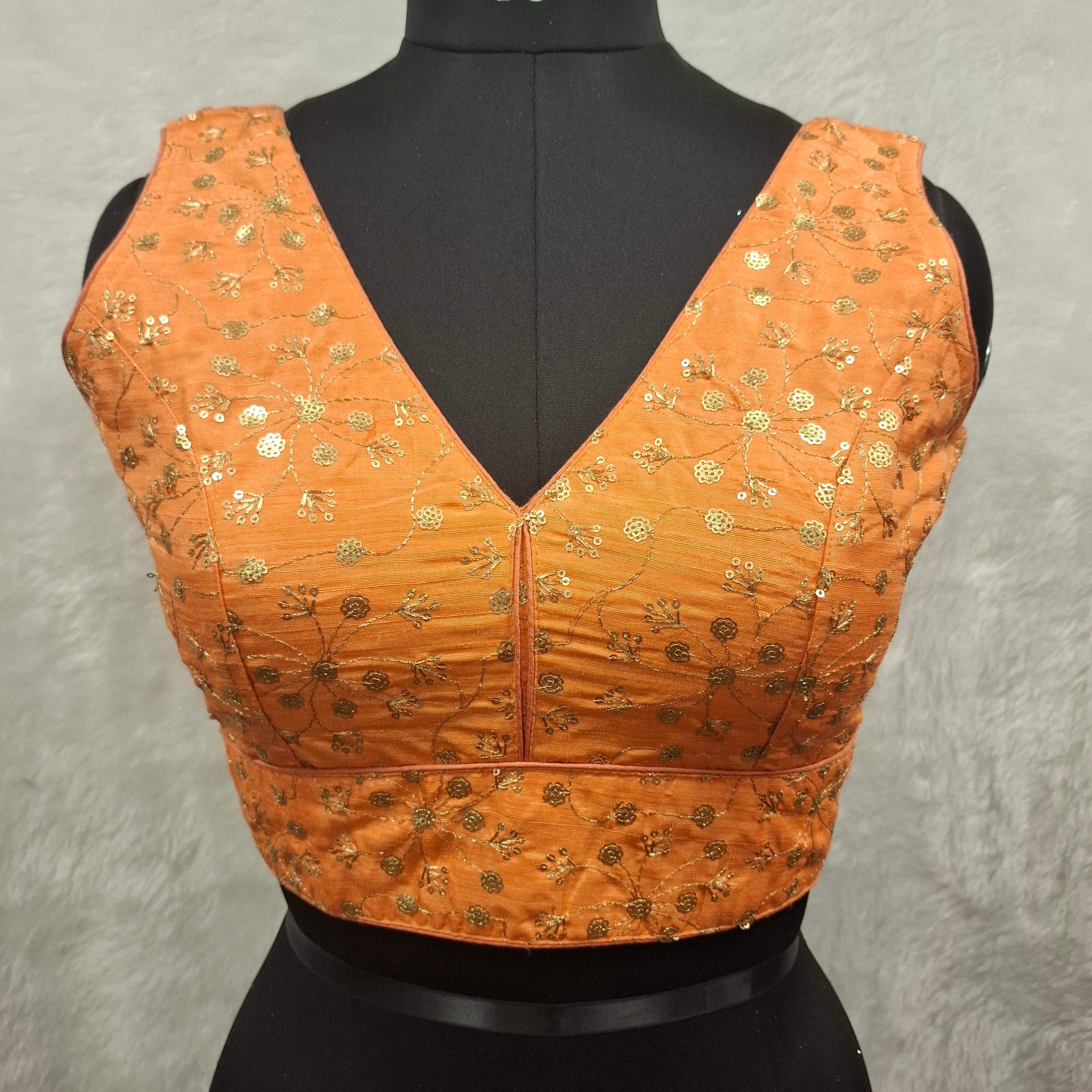 Orange twin tone readymade blouse with golden sequins and V-neckline