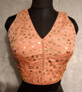 Peach twin-tone blouse with all-over golden sequins and V-neck design