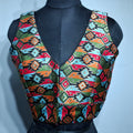 Black blouse featuring a multicolor geometric woven Patola pattern with V-neck.