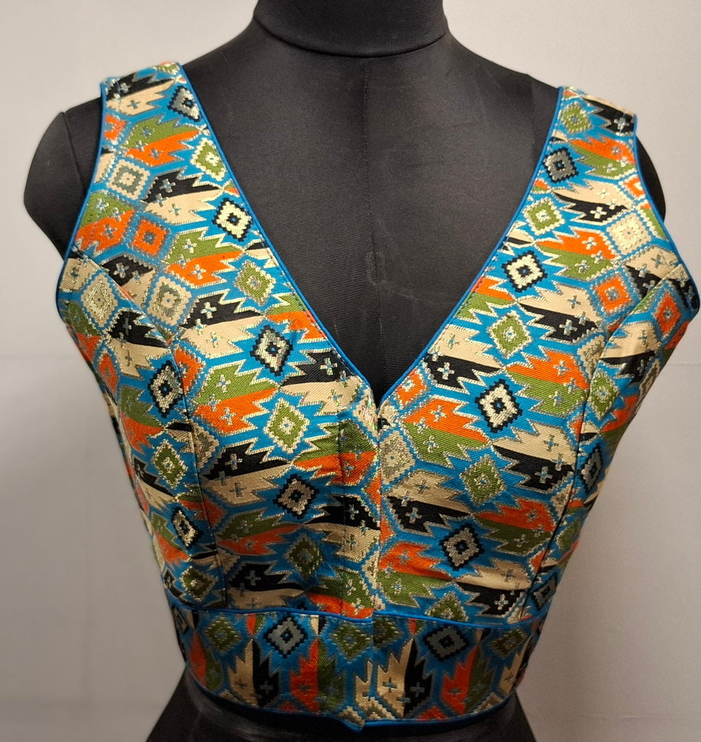 Cobalt blue blouse with multi-color geometric Patola weave and V-neck