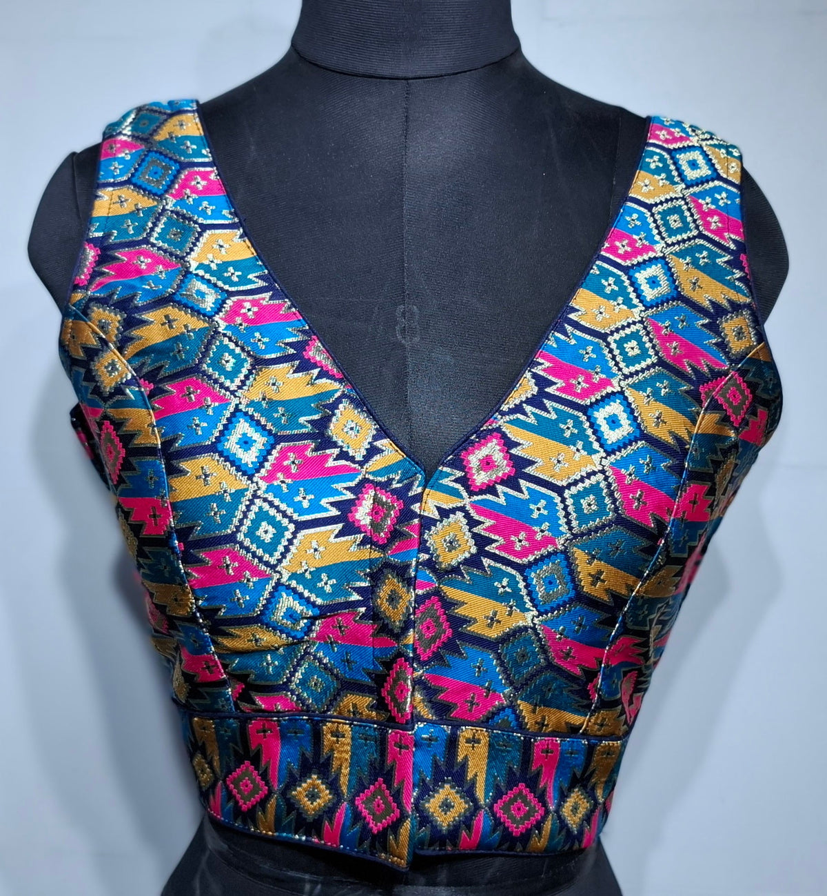 Navy blue blouse with multi-color geometric Patola weave and V-neck design