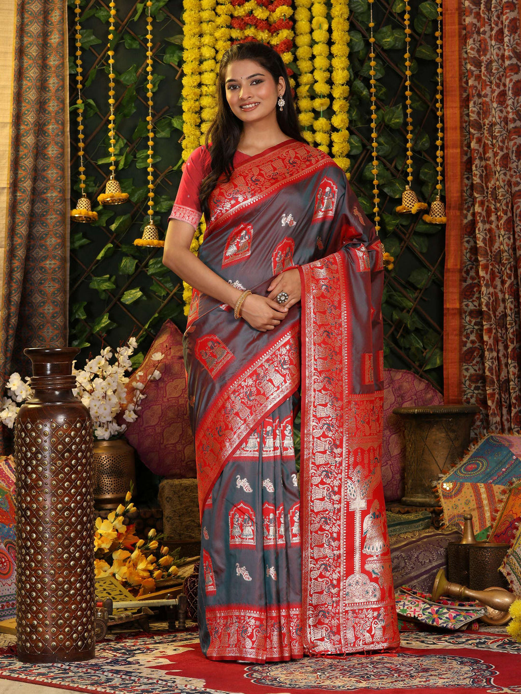 Grey silk saree featuring a vibrant red contrasting blouse piece.