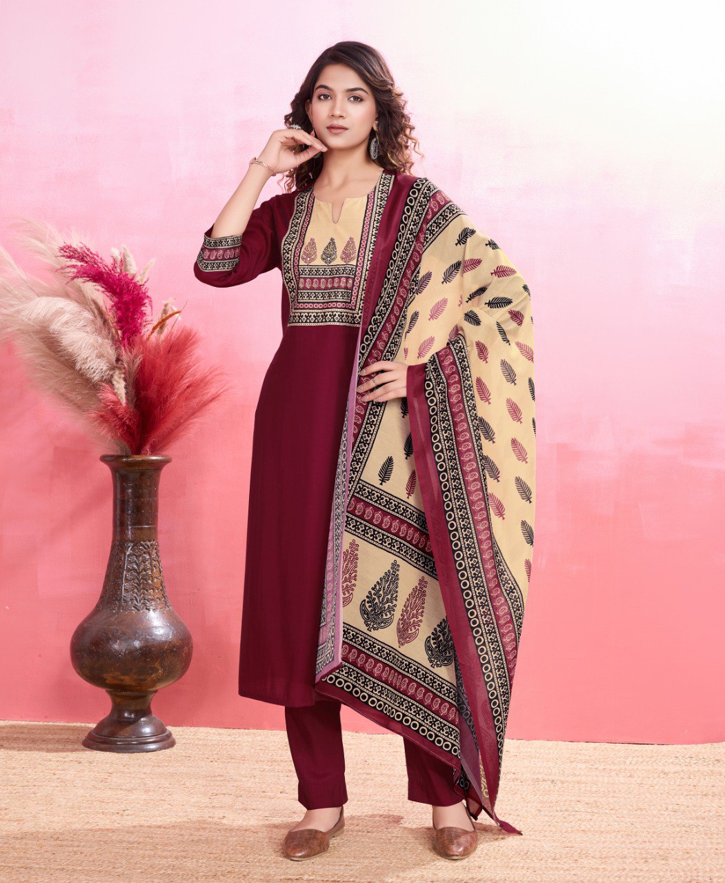 Model wearing a Maroon Viscose Silk printed kurta set