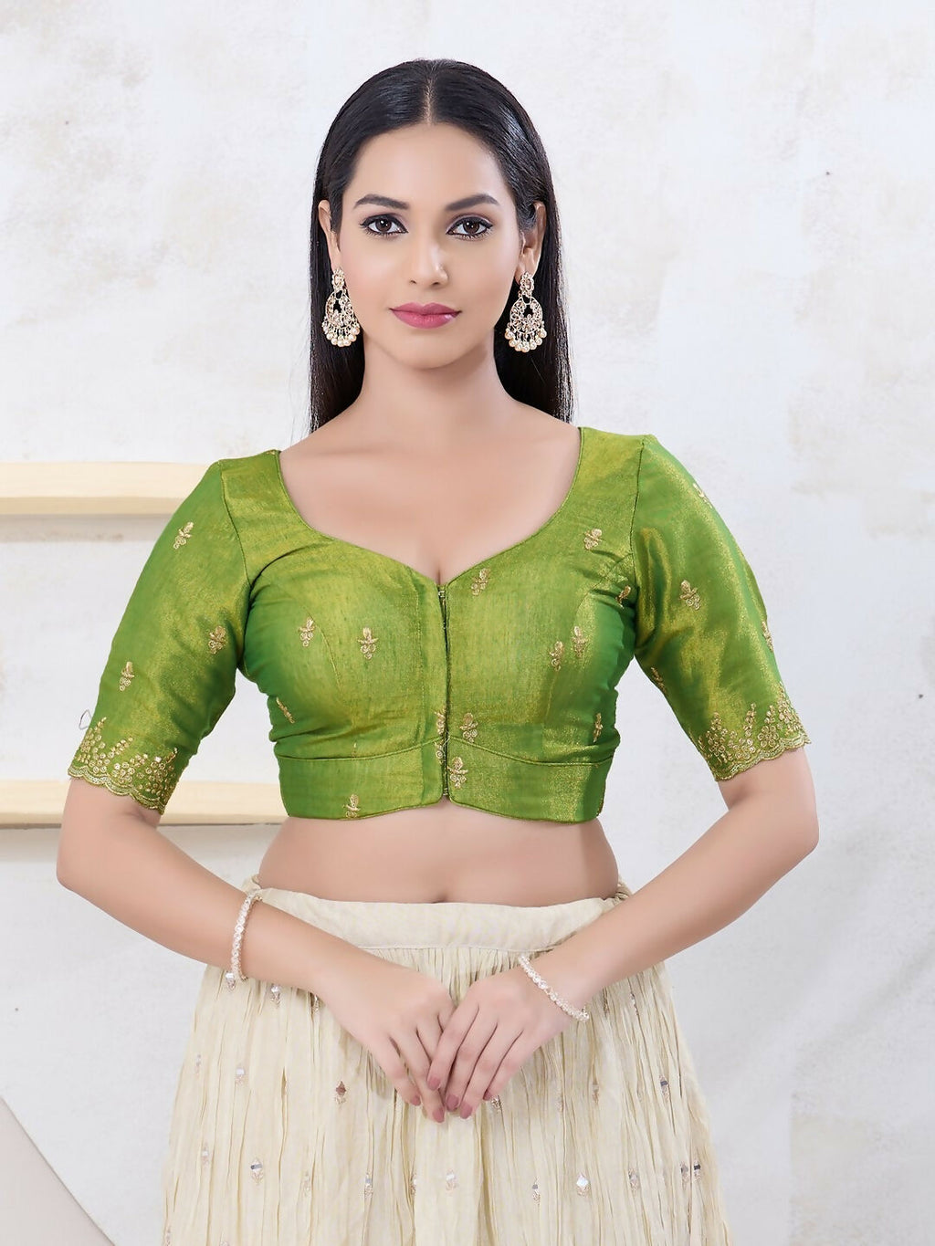 Green shimmer fabric blouse with elbow-length sleeves and round neckline