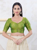 Green shimmer fabric blouse with elbow-length sleeves and round neckline