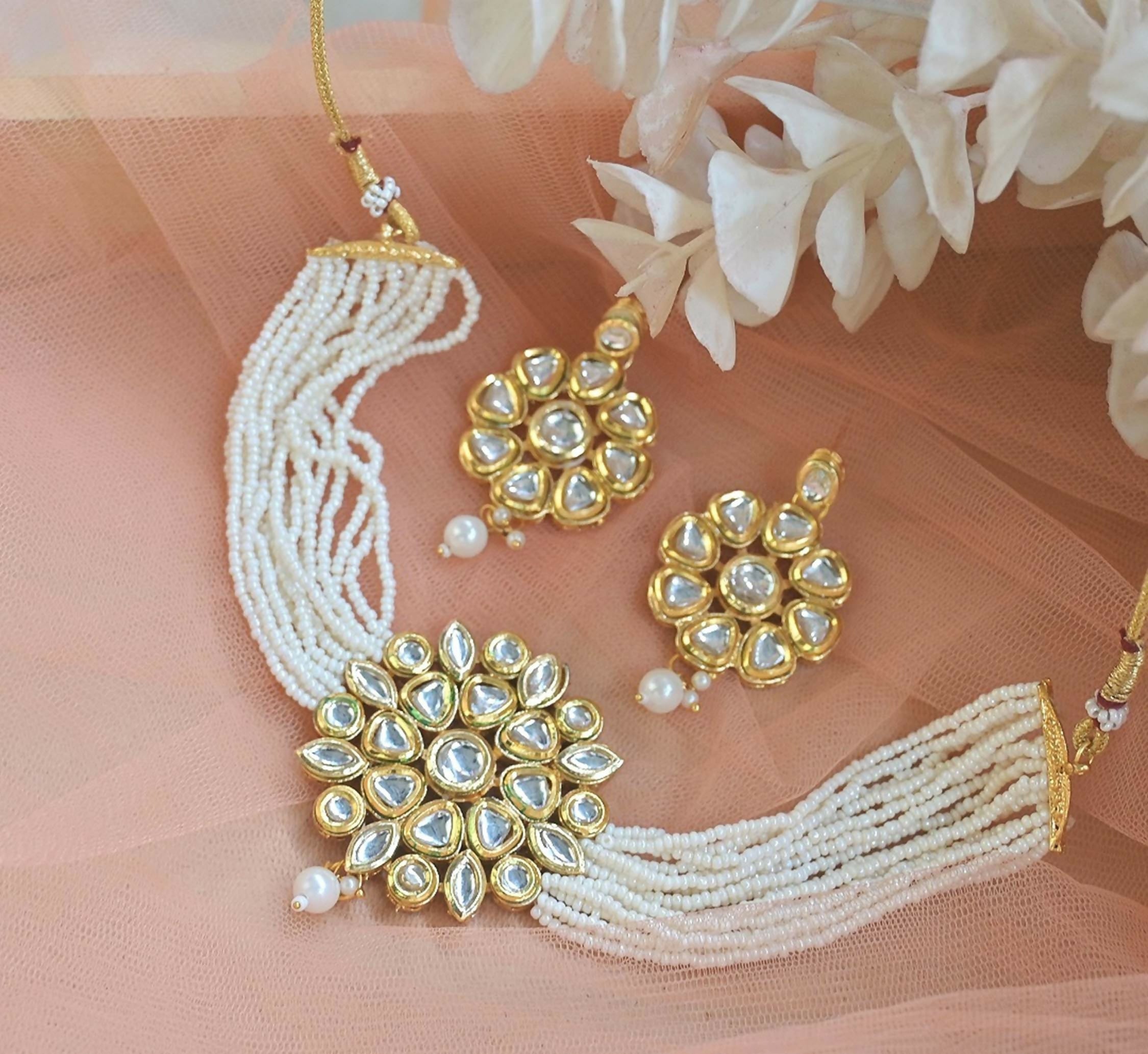 Close-up of a white Kundan choker with copper base and intricate craftsmanship