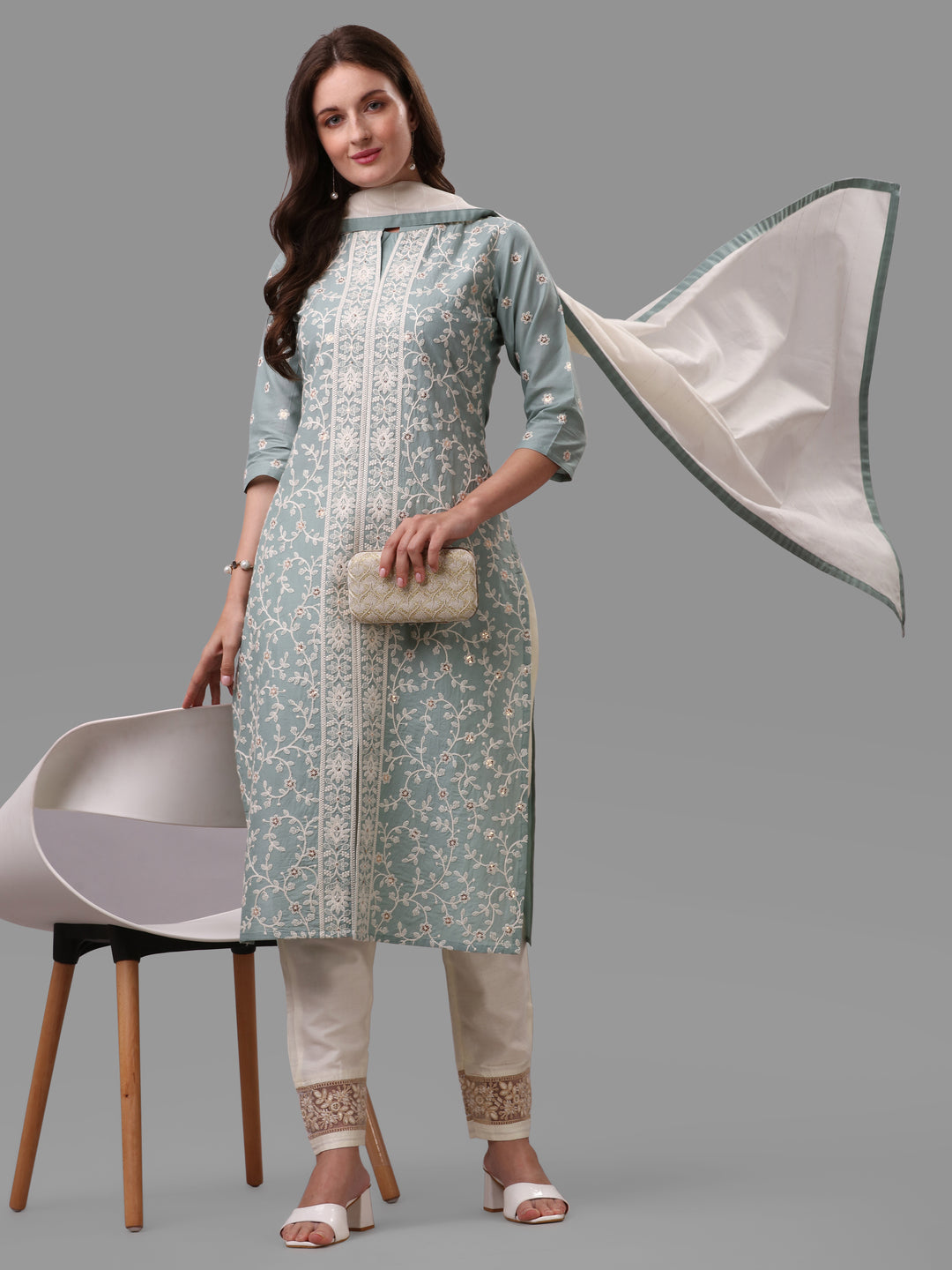 Woman wearing a multicolor embroidered rayon kurta set with matching pant and dupatta