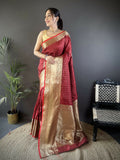 Brick red Banarasi silk saree with small butti motifs and unstitched blouse.