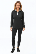 Model wearing a black long-sleeve quarter zip performance top with UV protection.