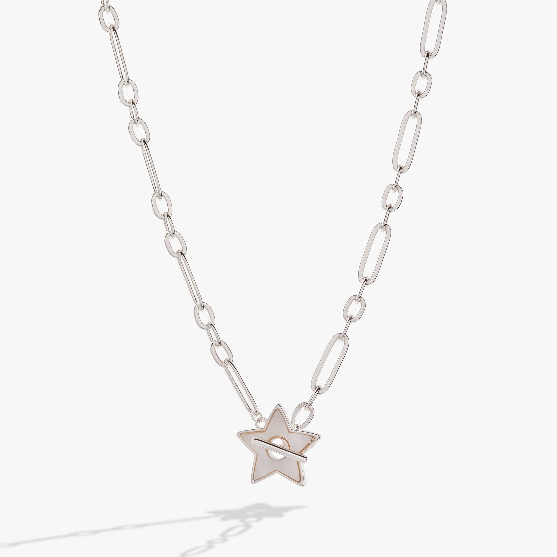 Silver open link chain necklace with a white mother of pearl star pendant and toggle closure