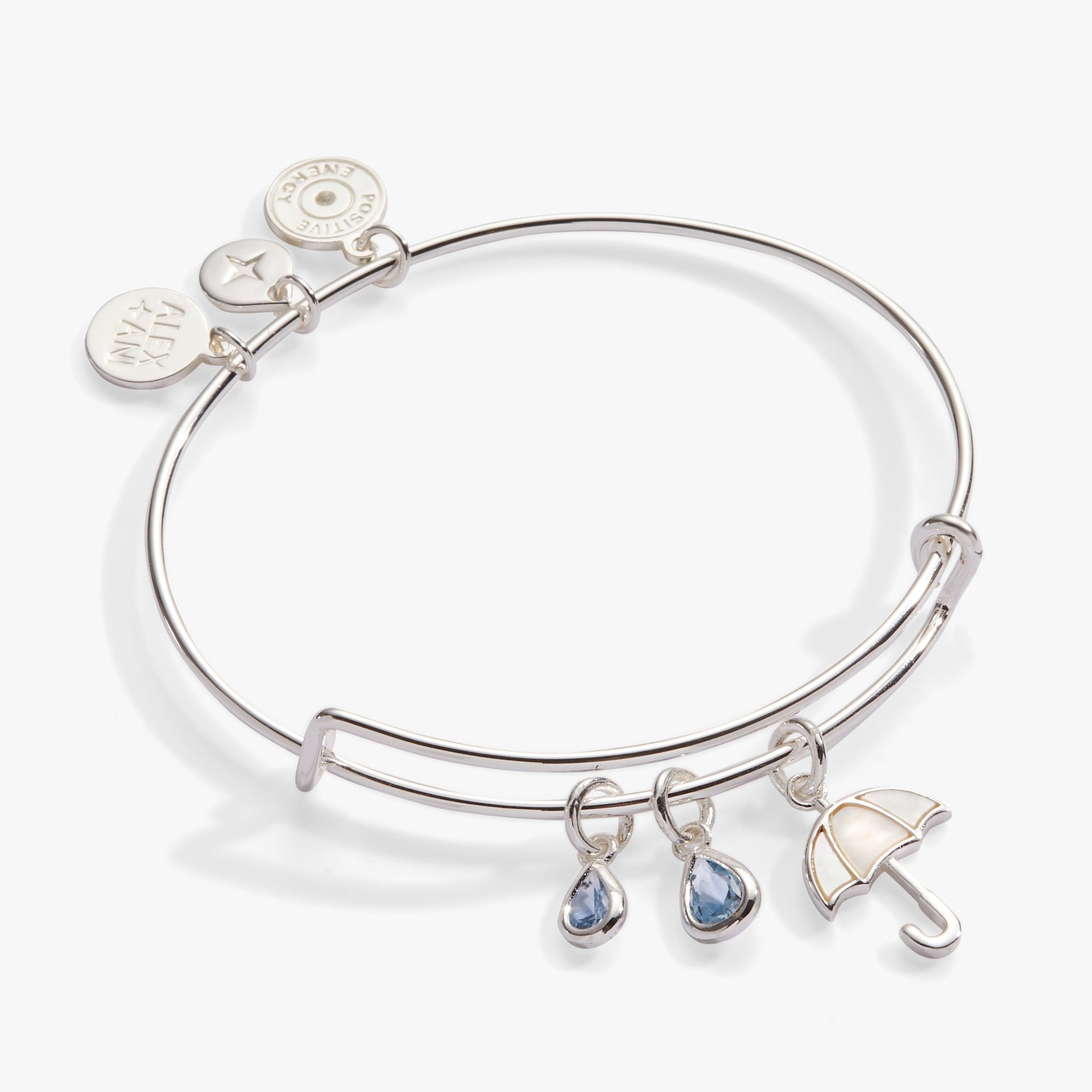 Silver-tone bangle featuring a mother-of-pearl umbrella charm and blue crystal raindrops