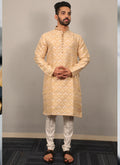 Beige soft silk kurta for men featuring detailed heavy jacquard embroidery at the neckline