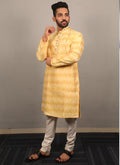 Men's yellow silk kurta featuring heavy jacquard neck design