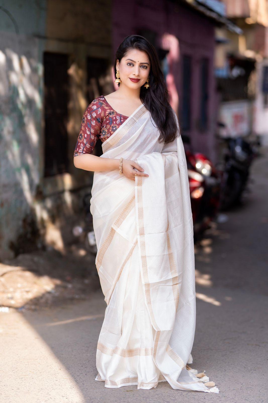 White silk blend Kalamkari saree with zari border and printed jute silk blouse piece.