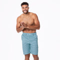 Men's hybrid swim shorts in teal and white scallop wave print with belt loops and button closure