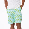Men's hybrid swim shorts featuring a green palm tree print on a sky blue background.