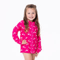 Girl's long sleeve zip-front swim cover up featuring a vibrant hot pink background with a white flamingo animal print pattern.