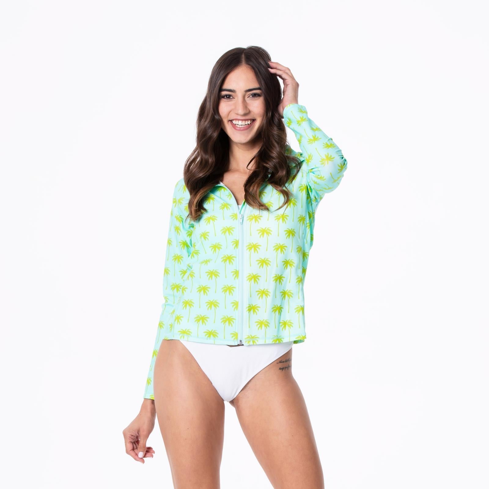 Long sleeve vacation cover-up featuring a palm tree print on a sky-blue background