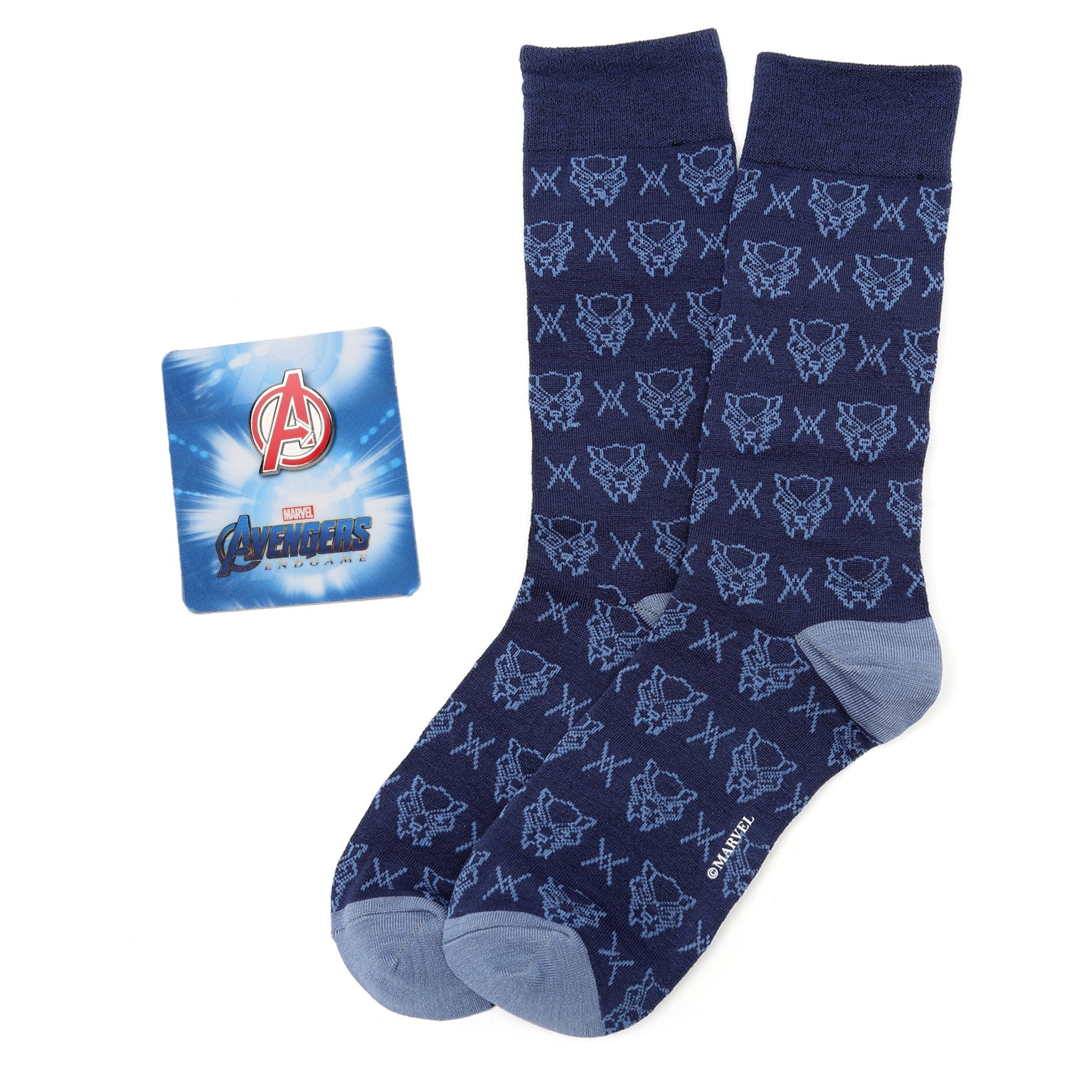 A pair of navy blue crew socks with a repeating Black Panther pattern next to a metallic Marvel Avengers logo lapel pin.