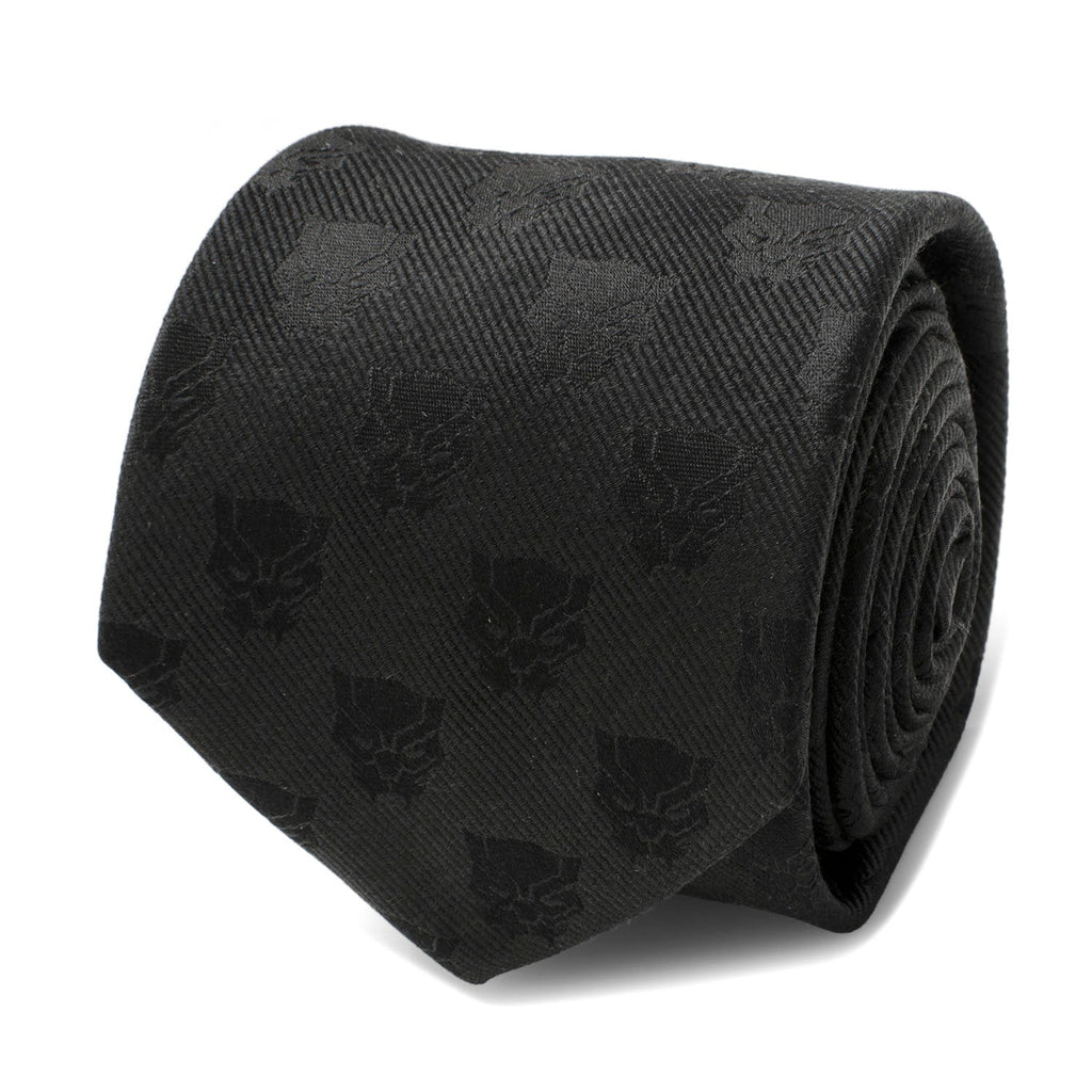 Close up of a black woven silk necktie with a repeated Black Panther face pattern.