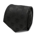 Close up of a black woven silk necktie with a repeated Black Panther face pattern.