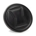 Close up view of a circular black metal Marvel Black Widow logo lapel pin