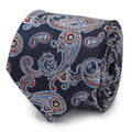 Close-up of a navy silk necktie with a red and blue paisley pattern featuring hidden Captain America shield logos