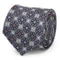 Close up of a gray silk necktie featuring a repeating navy and red Deadpool-themed stained glass pattern.