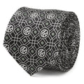 Close up of black Marvel Doctor Strange necktie with geometric pattern and sage green dots