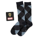 A gift set containing blue and black argyle socks with Rocket Raccoon print and a Groot character lapel pin on a Marvel branded backing card.