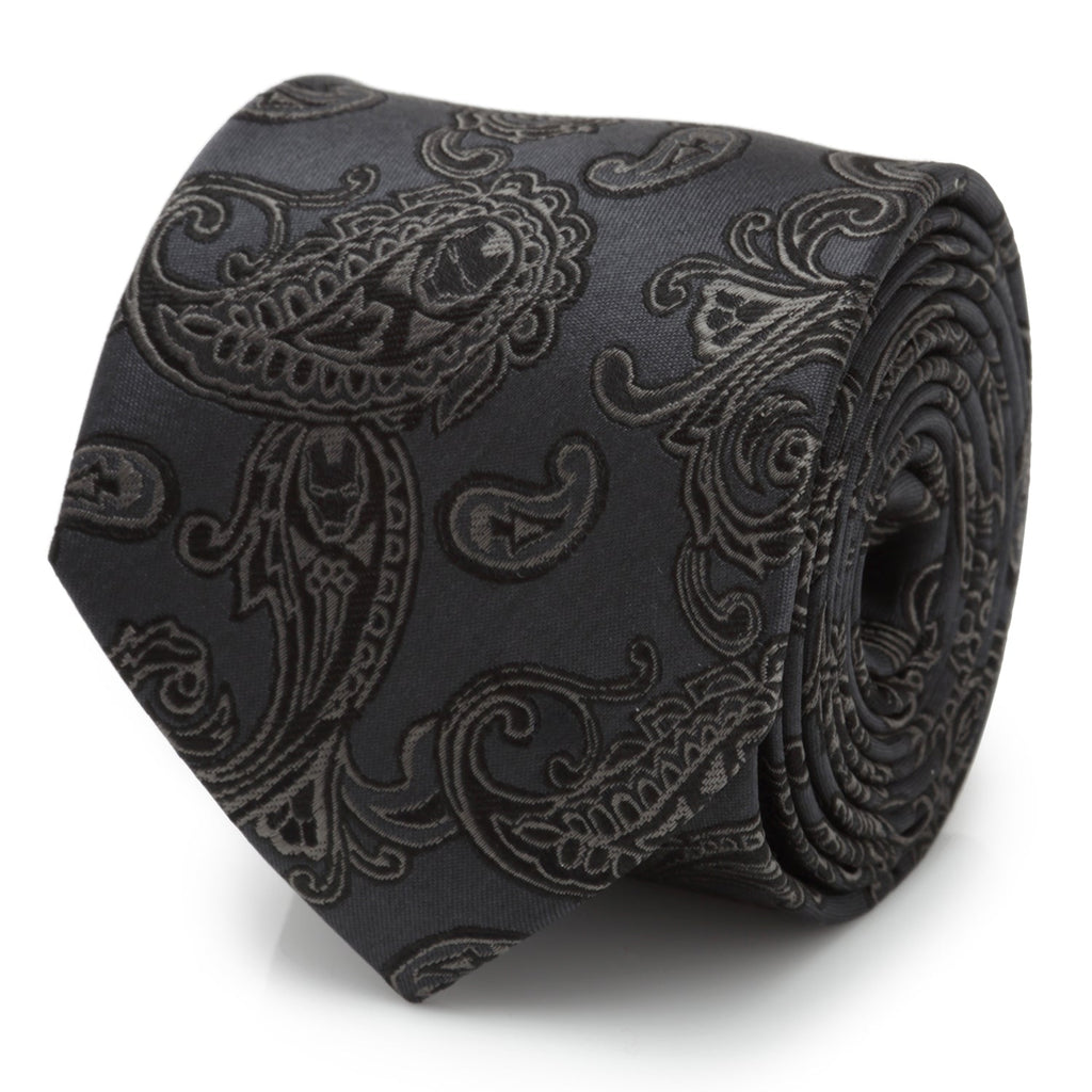 Close up of charcoal gray silk necktie with black paisley pattern and hidden Iron Man helmet logos