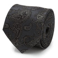 Close up of charcoal gray silk necktie with black paisley pattern and hidden Iron Man helmet logos