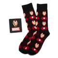 Marvel Iron Man gift set featuring black socks with red and gold armor details next to an Iron Man helmet lapel pin.
