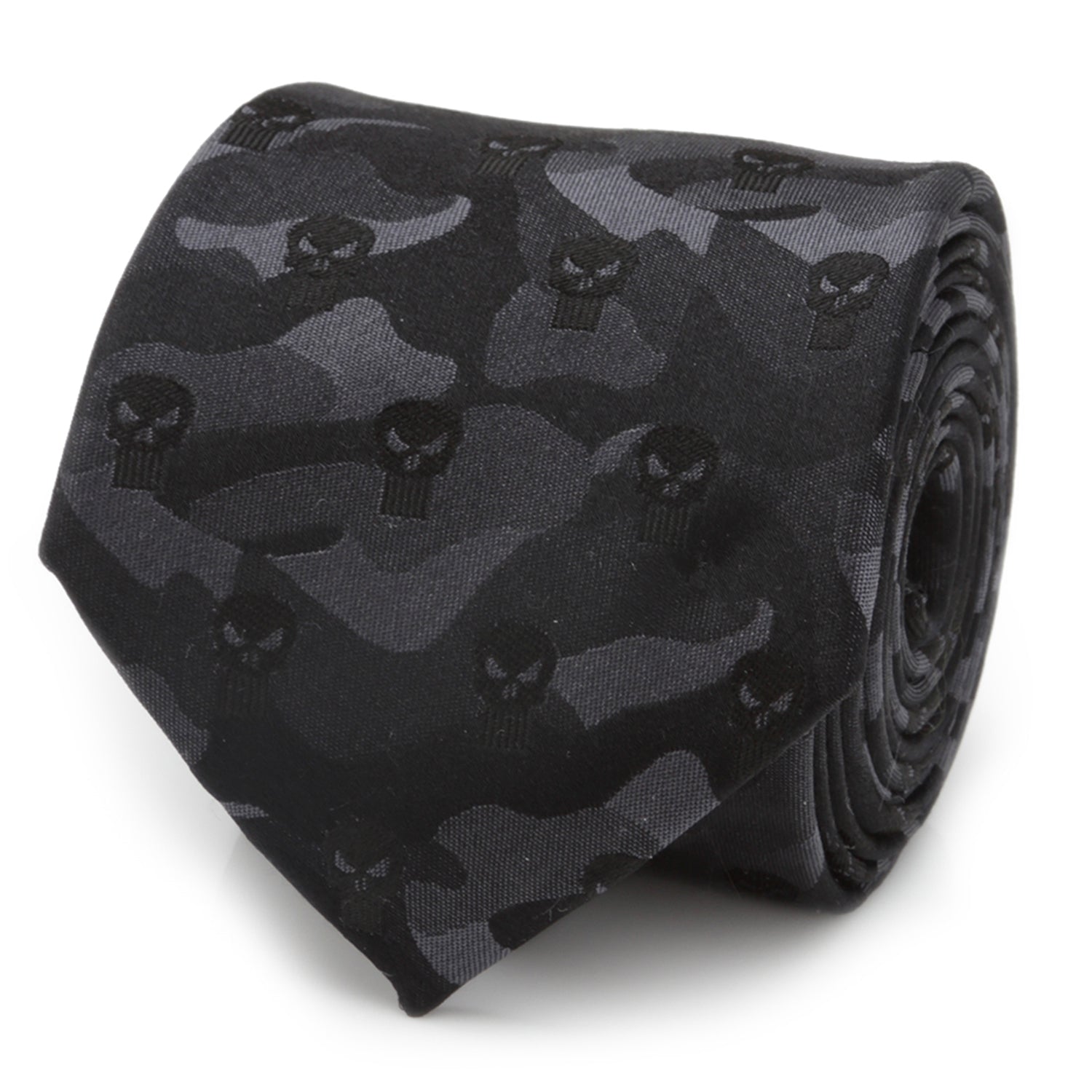 A rolled black silk necktie featuring a subtle camouflage pattern and Punisher skull icons, shown on a white background and styled on a man in a gray suit.