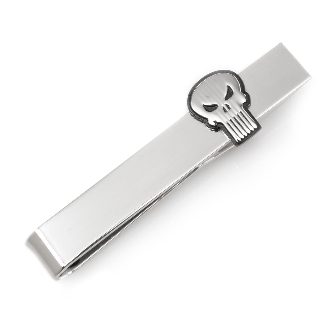 Close-up of a Marvel The Punisher skull logo silver tie bar displayed on a camouflage patterned necktie against a grey suit background.