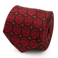 Close up of a black silk necktie featuring a repeating red Ten Rings crest pattern from Shang-Chi