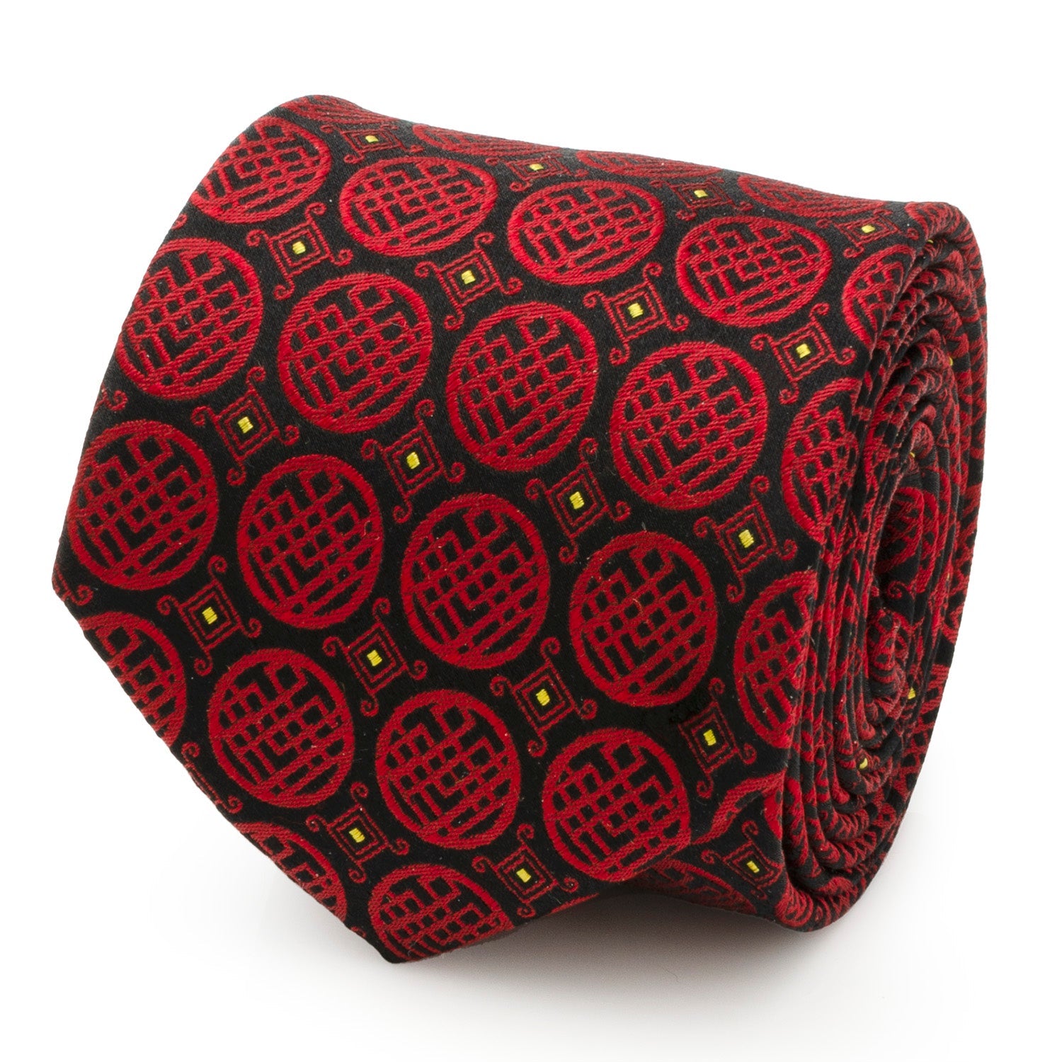 Close up of a black silk necktie featuring a repeating red Ten Rings crest pattern from Shang-Chi