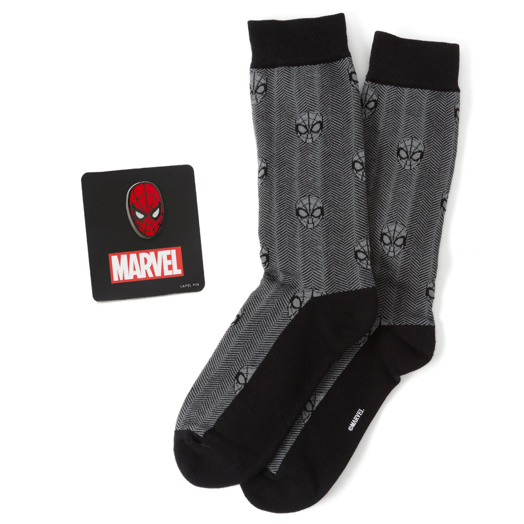 Spider-Man themed gift set featuring black herringbone socks and a detailed metal Spider-Man mask lapel pin.