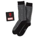 Spider-Man themed gift set featuring black herringbone socks and a detailed metal Spider-Man mask lapel pin.