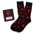 A gift set featuring black and red Spider-Man web-patterned crew socks paired with a Spider-Man mask enamel lapel pin.