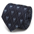 Close up of a navy blue silk necktie with a pale blue diamond grid pattern and Spider-Man icon print.