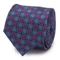 Close up of a navy blue silk necktie with a repeated pattern of purple Thor Mjolnir hammers.
