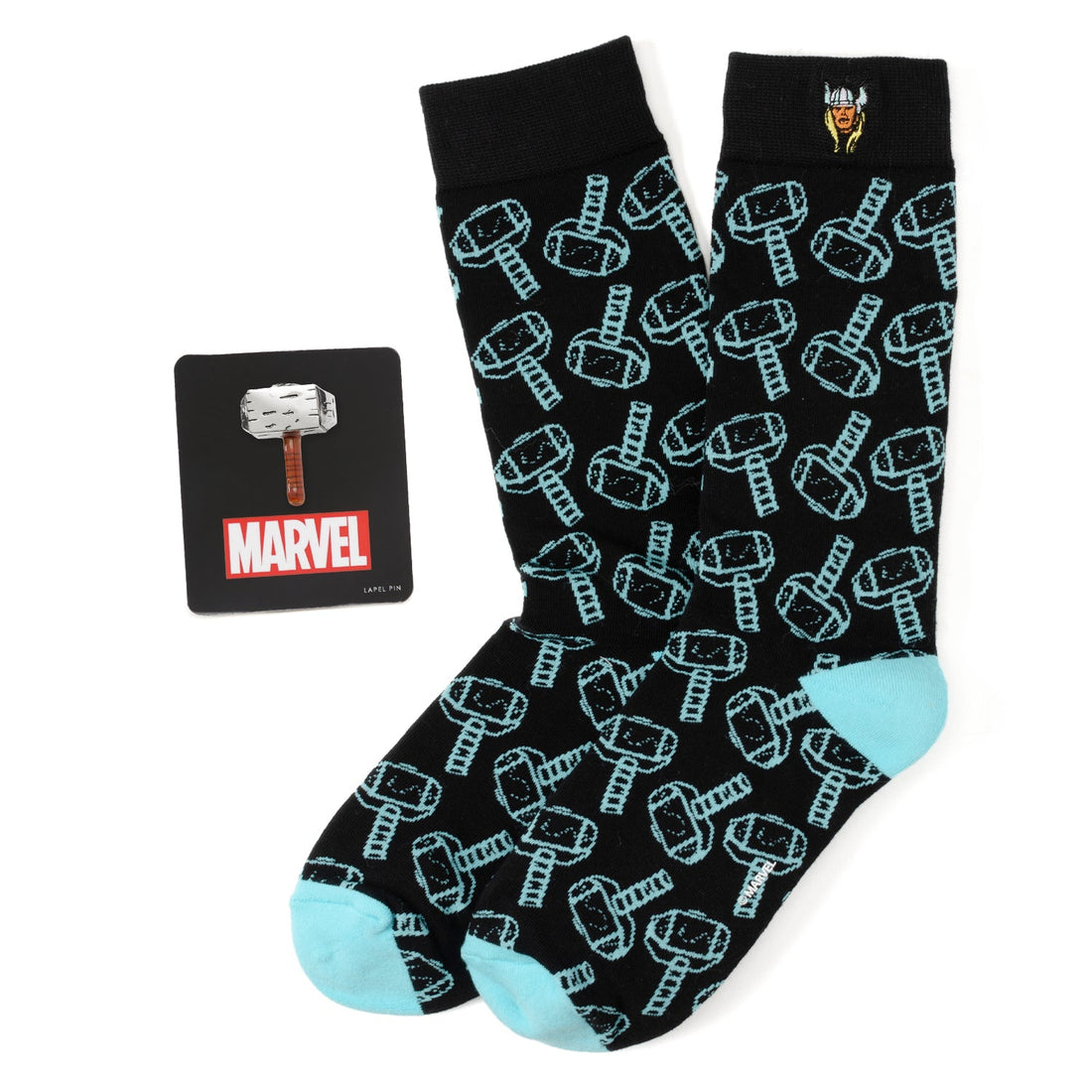 A Marvel Thor themed gift set including black socks with a light blue hammer pattern and a 3D Mjolnir lapel pin.