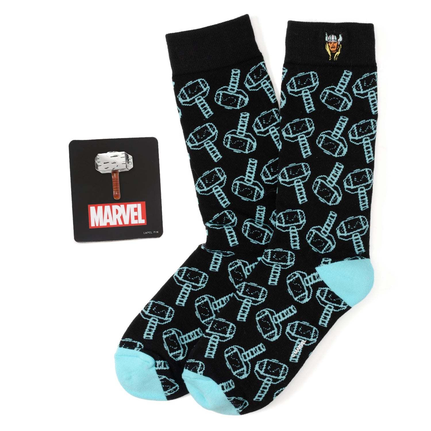 A Marvel Thor themed gift set including black socks with a light blue hammer pattern and a 3D Mjolnir lapel pin.
