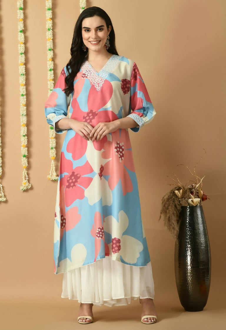 A woman wearing a vibrant floral print Maslin kurta set in bohemian fusion style.