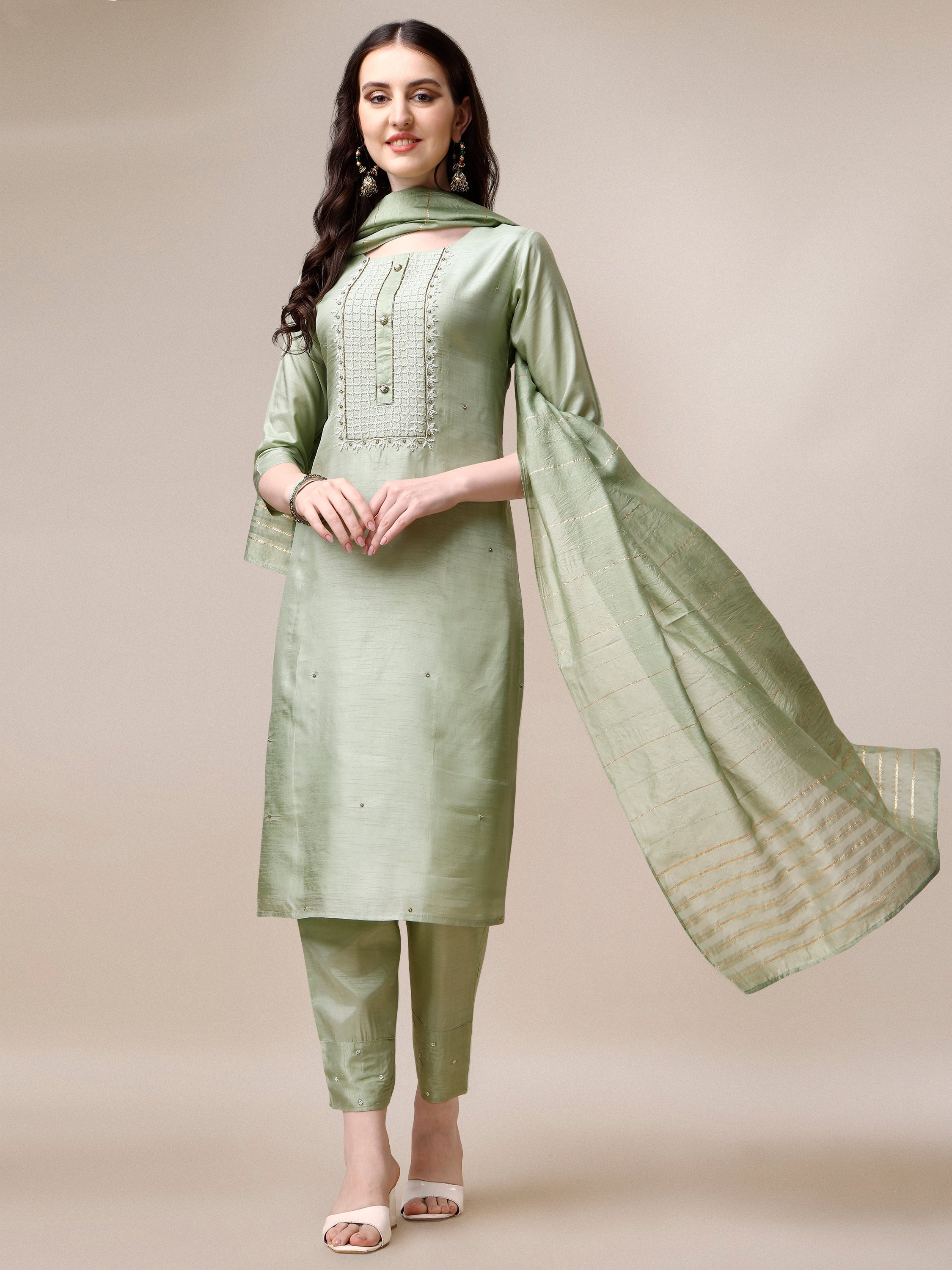 Woman wearing a multicolor embroidered rayon kurta set with matching pants and dupatta