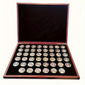 46-piece replica US commemorative coin collection in a brown and black display case
